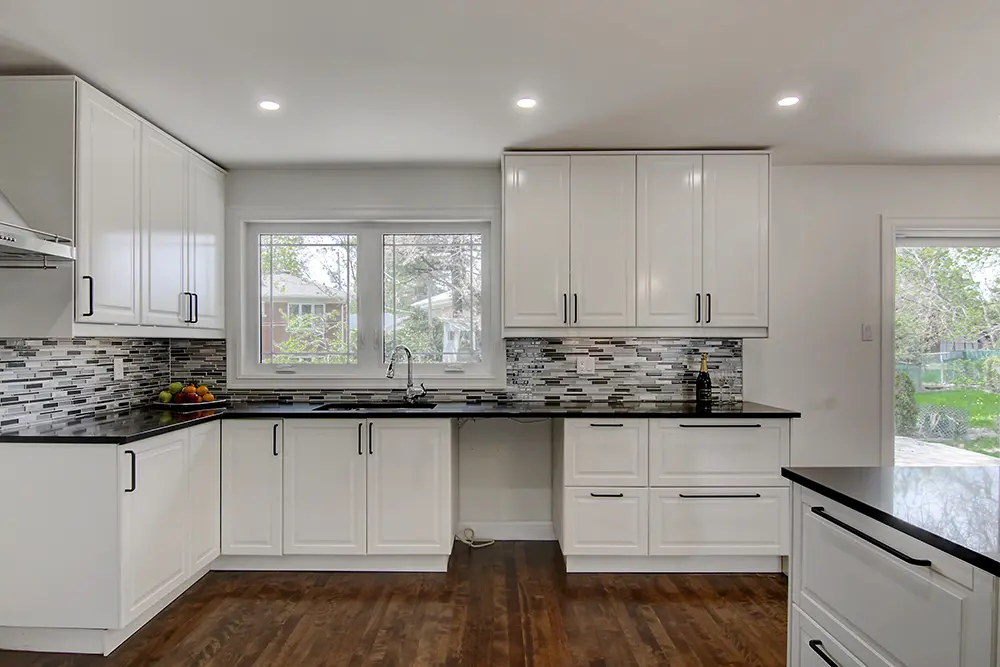 Bright kitchen remodel in Montreal with open layout and modern finishes